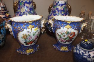 A pair of Continental porcelain gilt and floral de