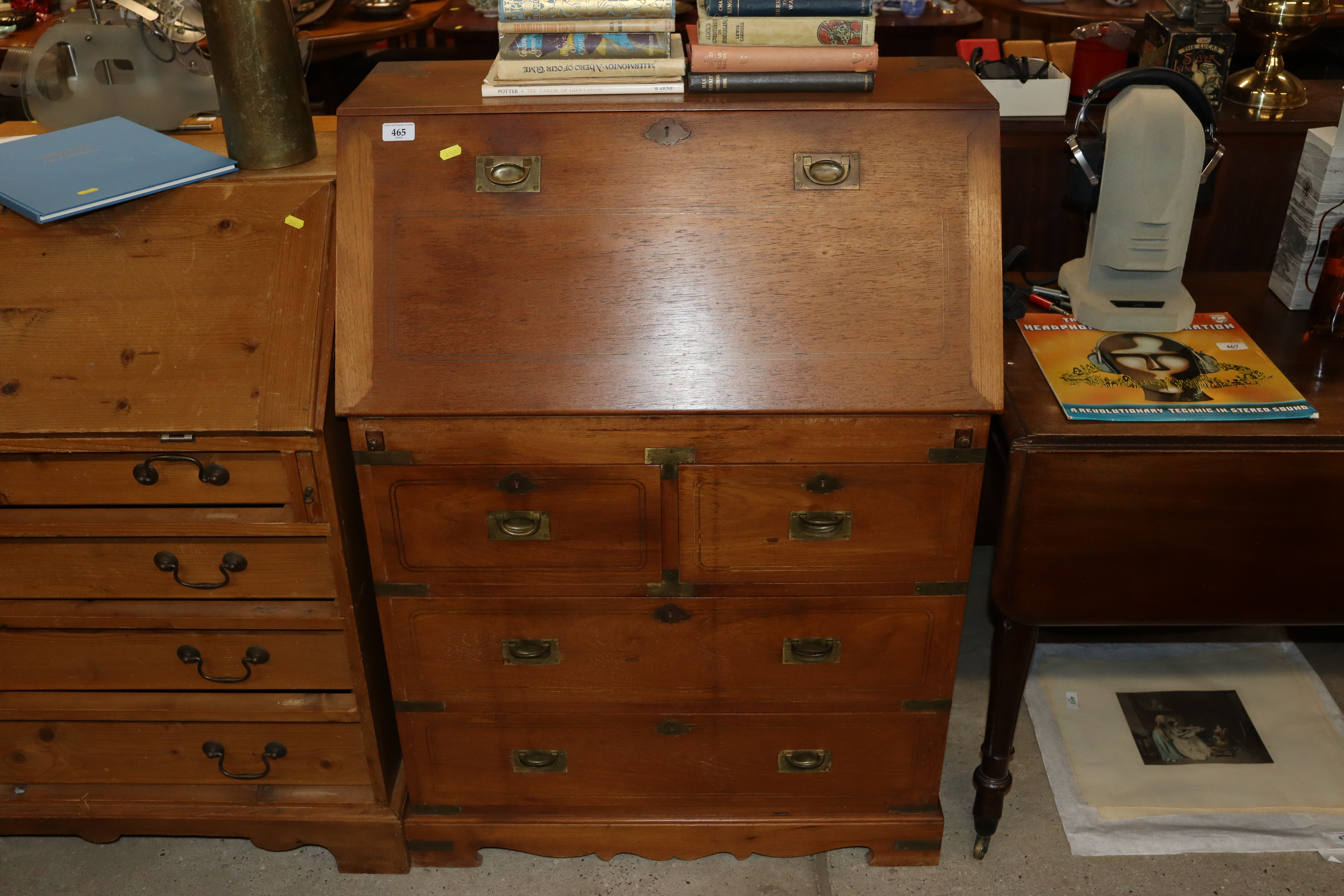 An oak and brass inlaid Campaign style bureau