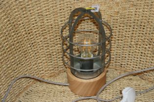 A wooden and metalware industrial style table lamp