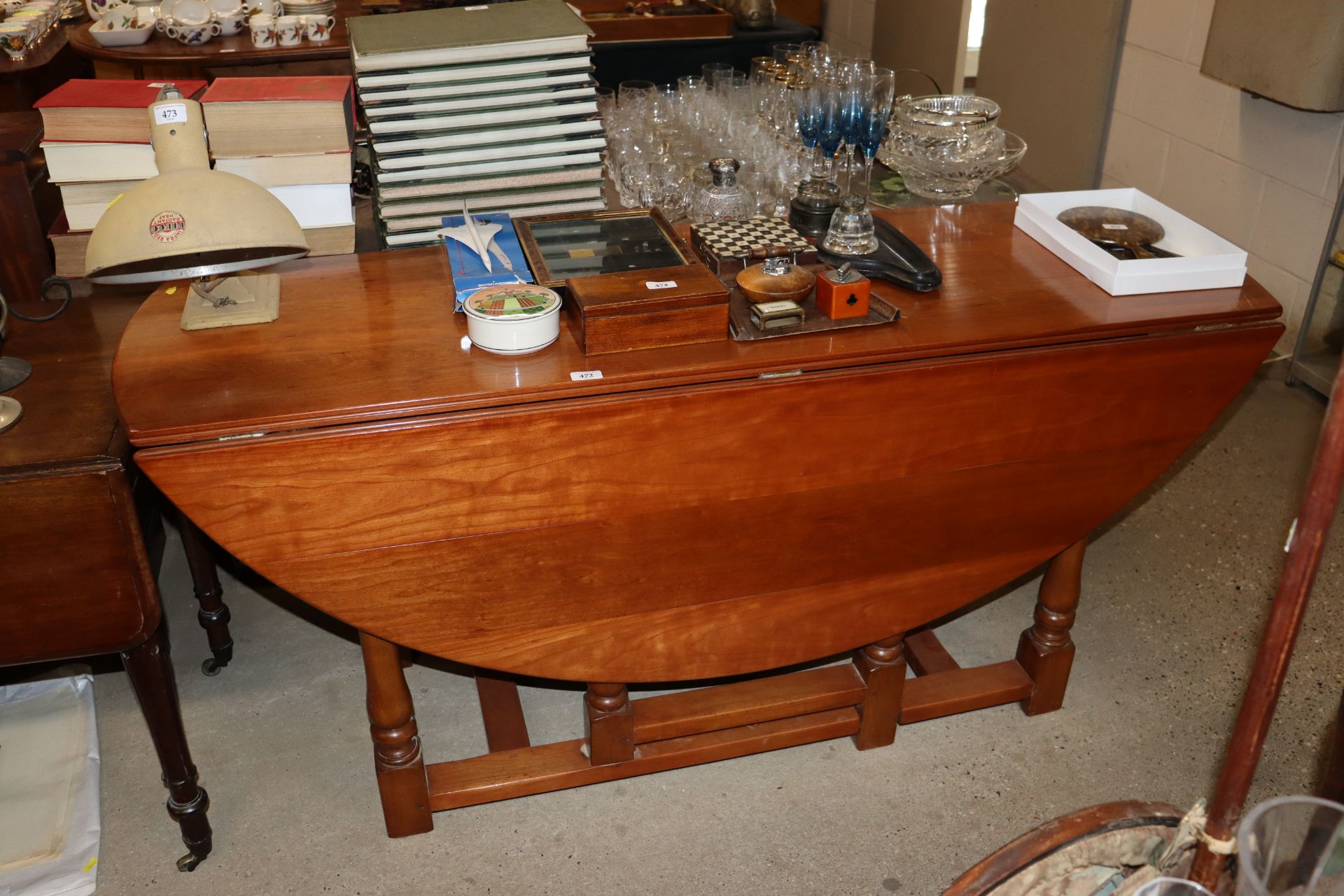 A cherrywood drop leaf dining table