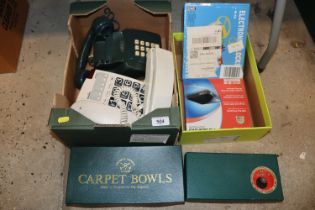 Two boxes containing carpet bowls, telephones, ele