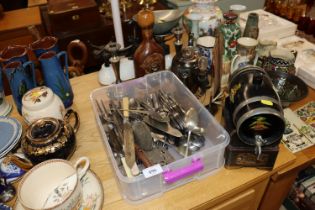 A box of various flatware, silver plated candlesti