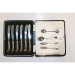 A cased set of six silver handled butter knives; t