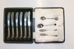 A cased set of six silver handled butter knives; t