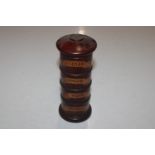 A wooden spice tower