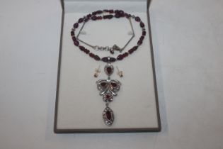 A Sterling silver garnet and white sapphire necklace and pair of ear-rings