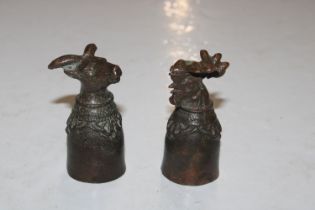 Two Tibetan bronze stirrup or ritual cups