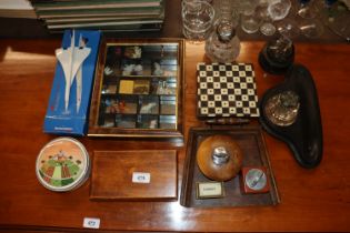 A display case of various ornaments; a boxed model