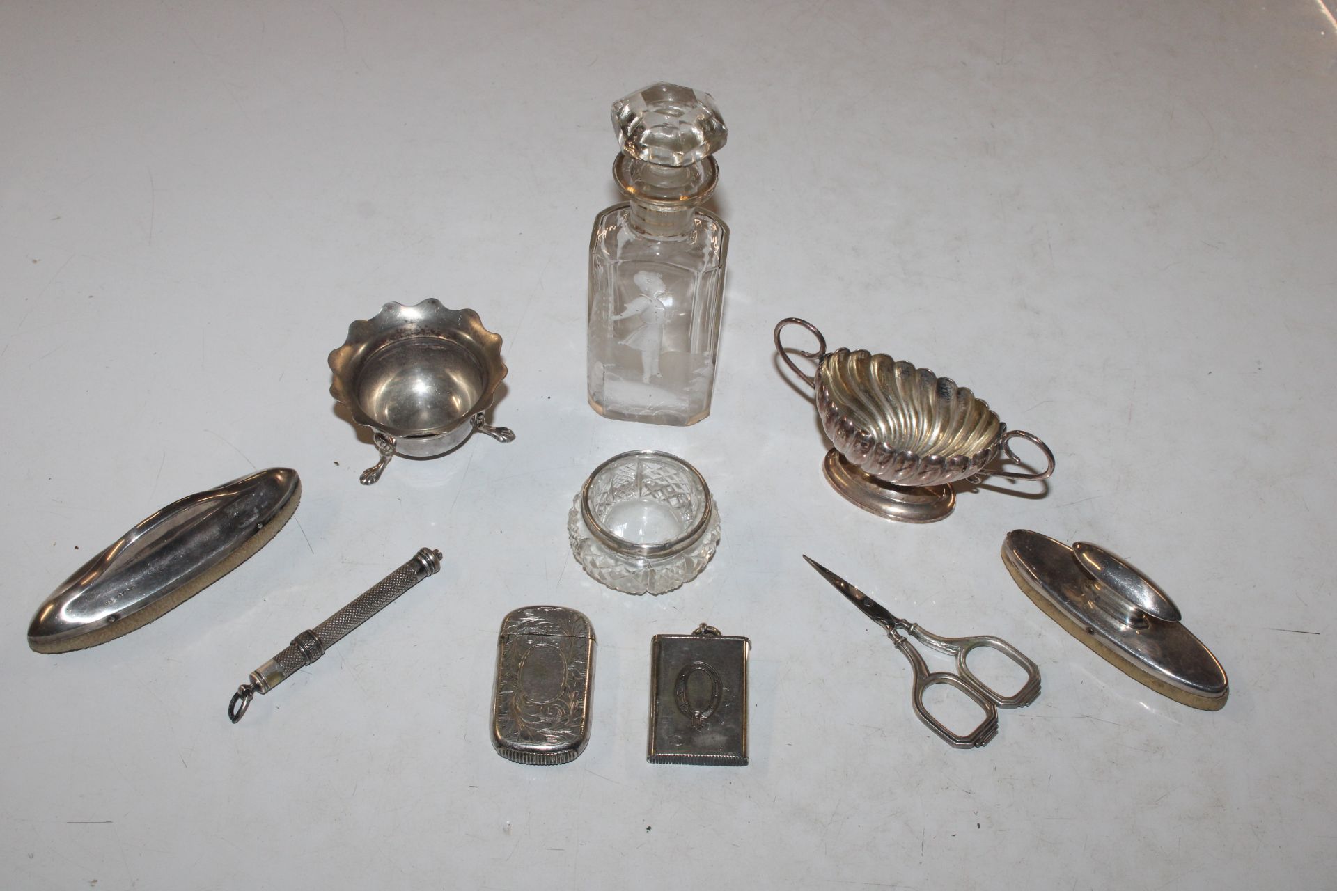 Two vesta cases; two silver mounted nail buffers;