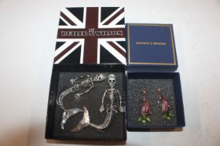 A boxed pair of Butler & Wilson earrings in the f