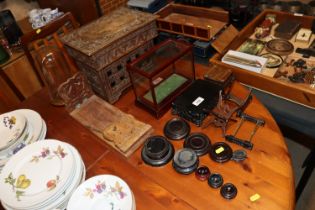 A quantity of Oriental display plinths, a carved s