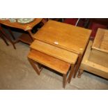 An oak nest of three occasional tables