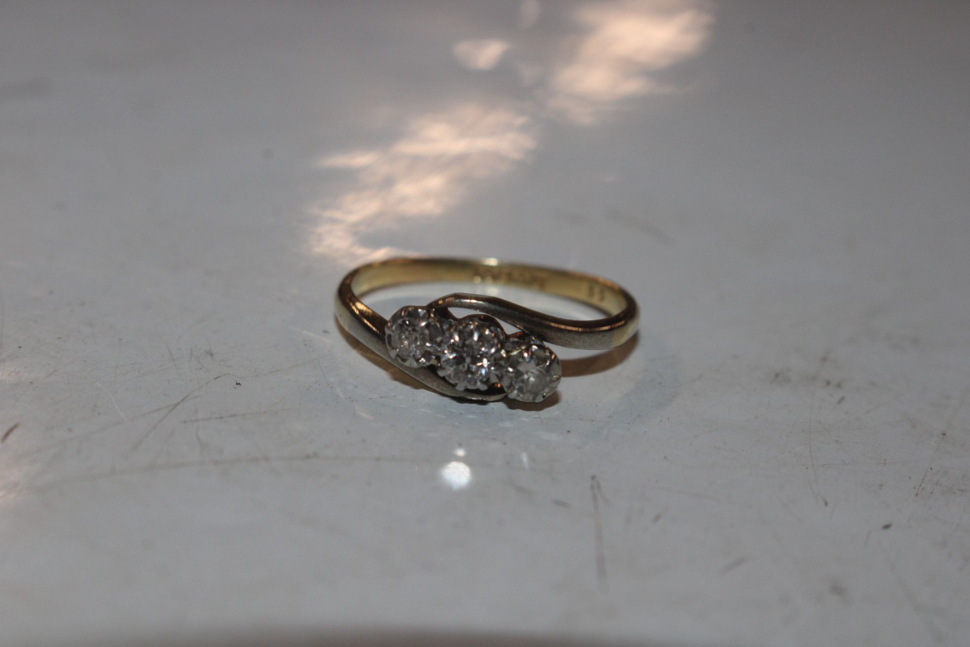 A 18ct gold and platinum diamond three stone ring, - Image 2 of 5