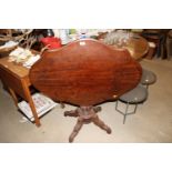 A 19th Century mahogany shaped topped occasional t