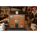 A large vintage dolls house and contents