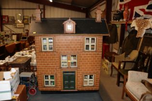 A large vintage dolls house and contents