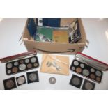 A box containing Royal Commemorative and other coi