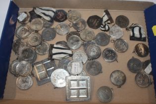 A tray of swimming related medals