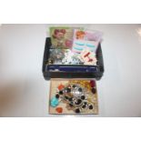 Two boxes containing assorted glass, bead and othe
