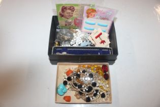 Two boxes containing assorted glass, bead and othe