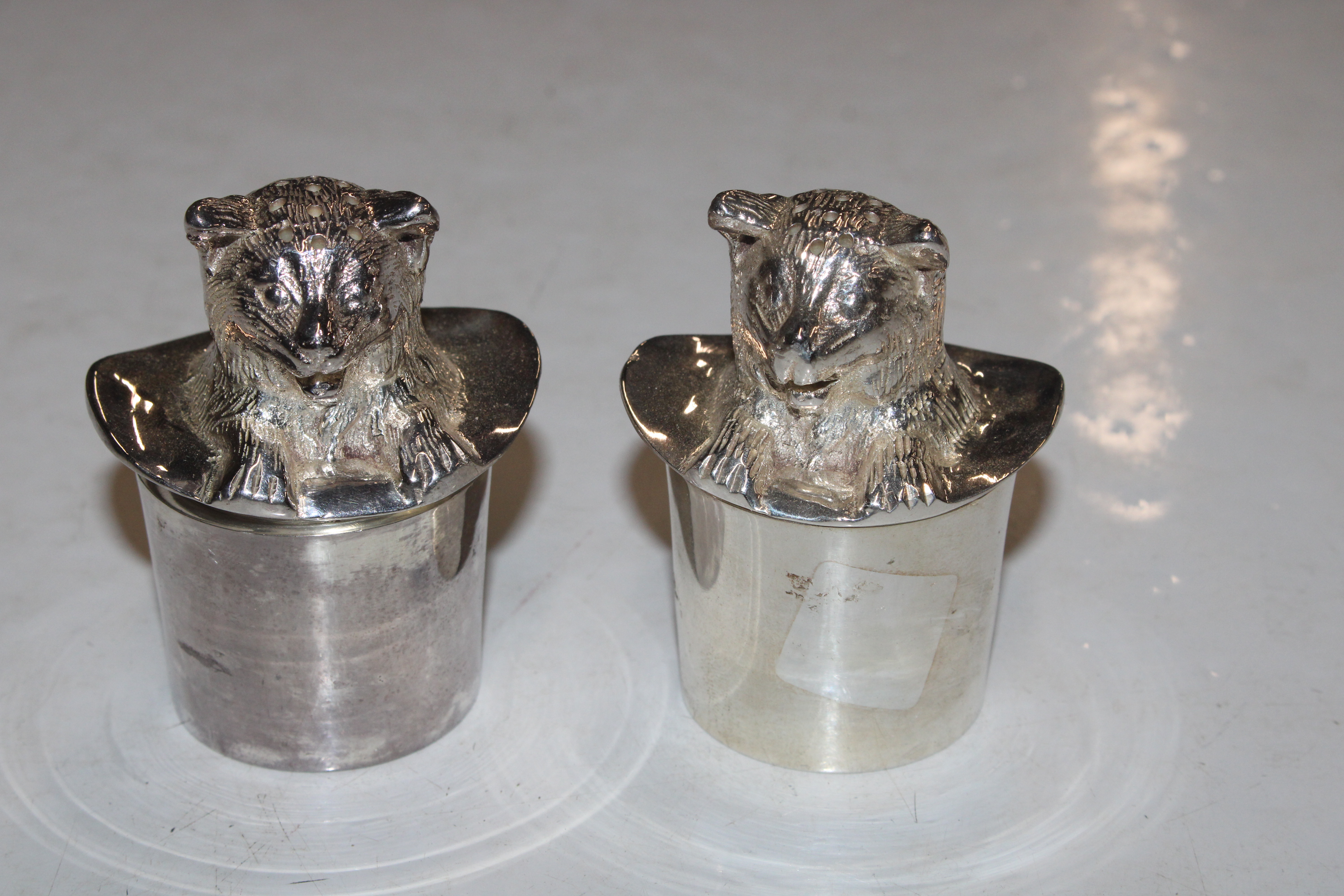A pair of silver plated "Cat In The Hat" salt and
