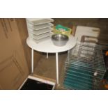 A white circular Melamine table