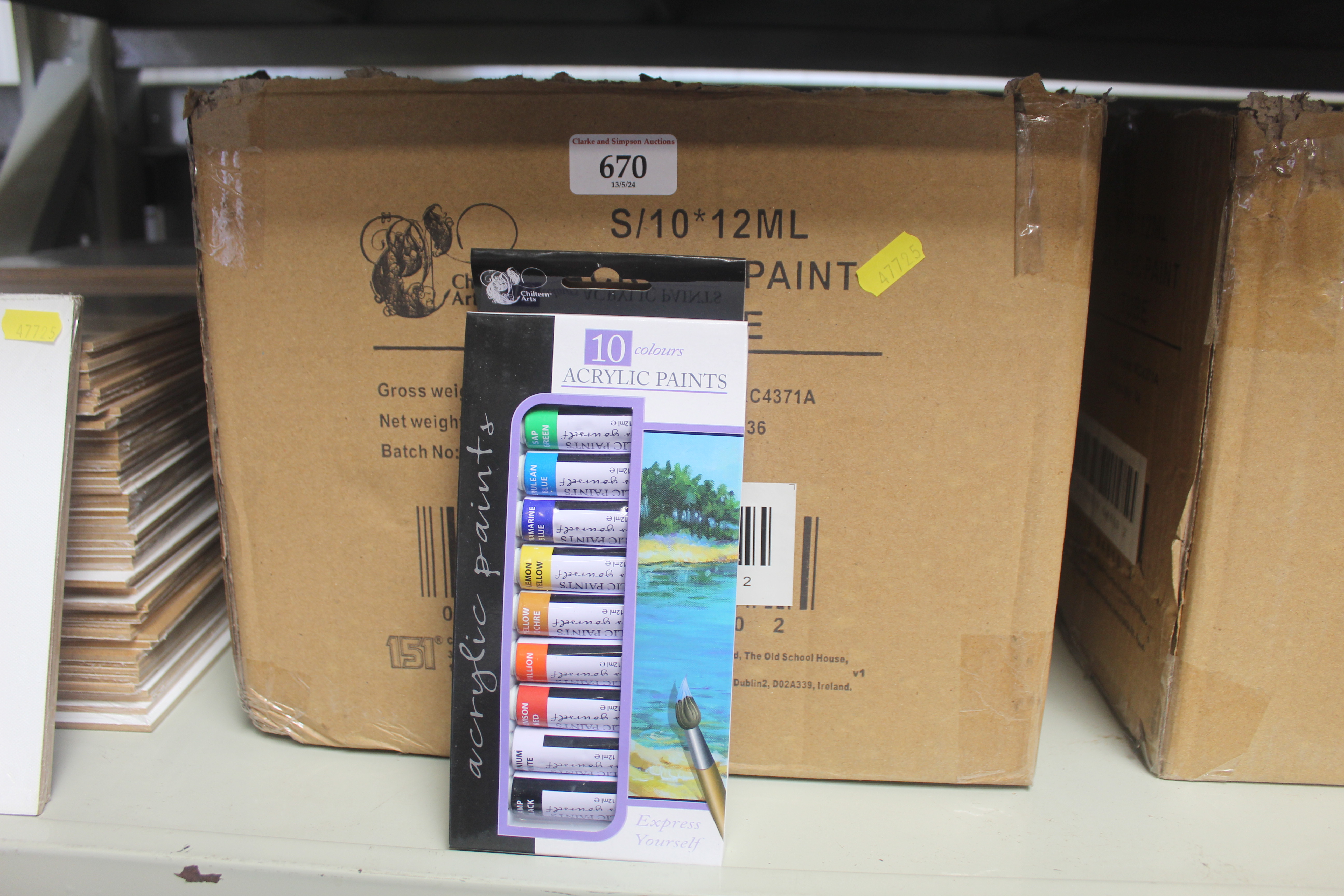 Two boxes containing a quantity of acrylic paints
