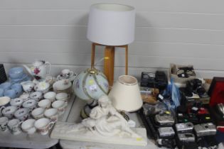 A plaster figure and three table lamps