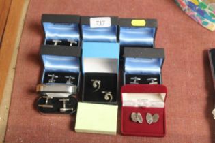 A pair of silver cufflinks and eight other pairs o