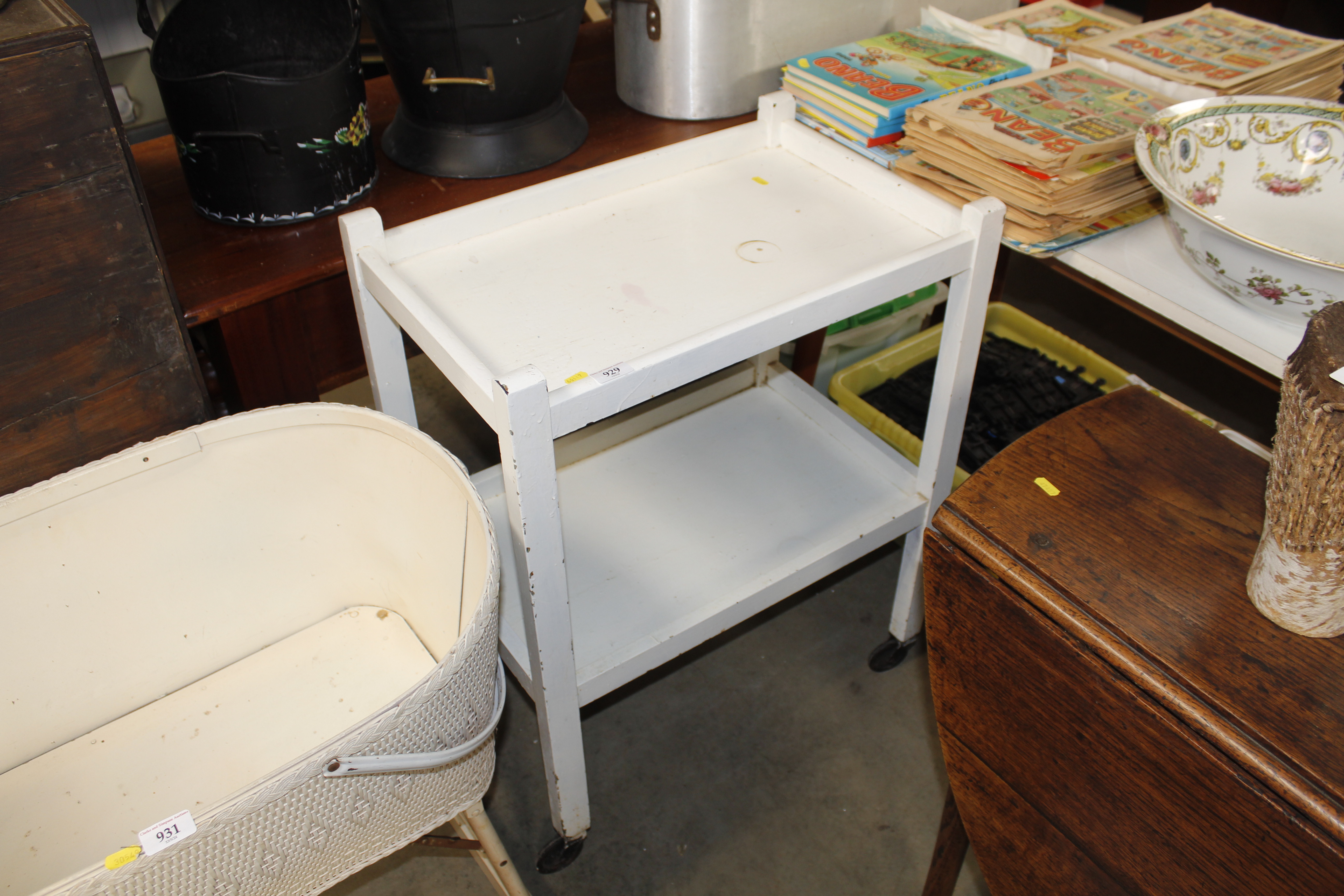 A white painted two tier tea trolley