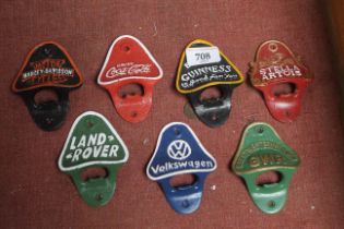 Seven reproduction advertising bottle openers (103