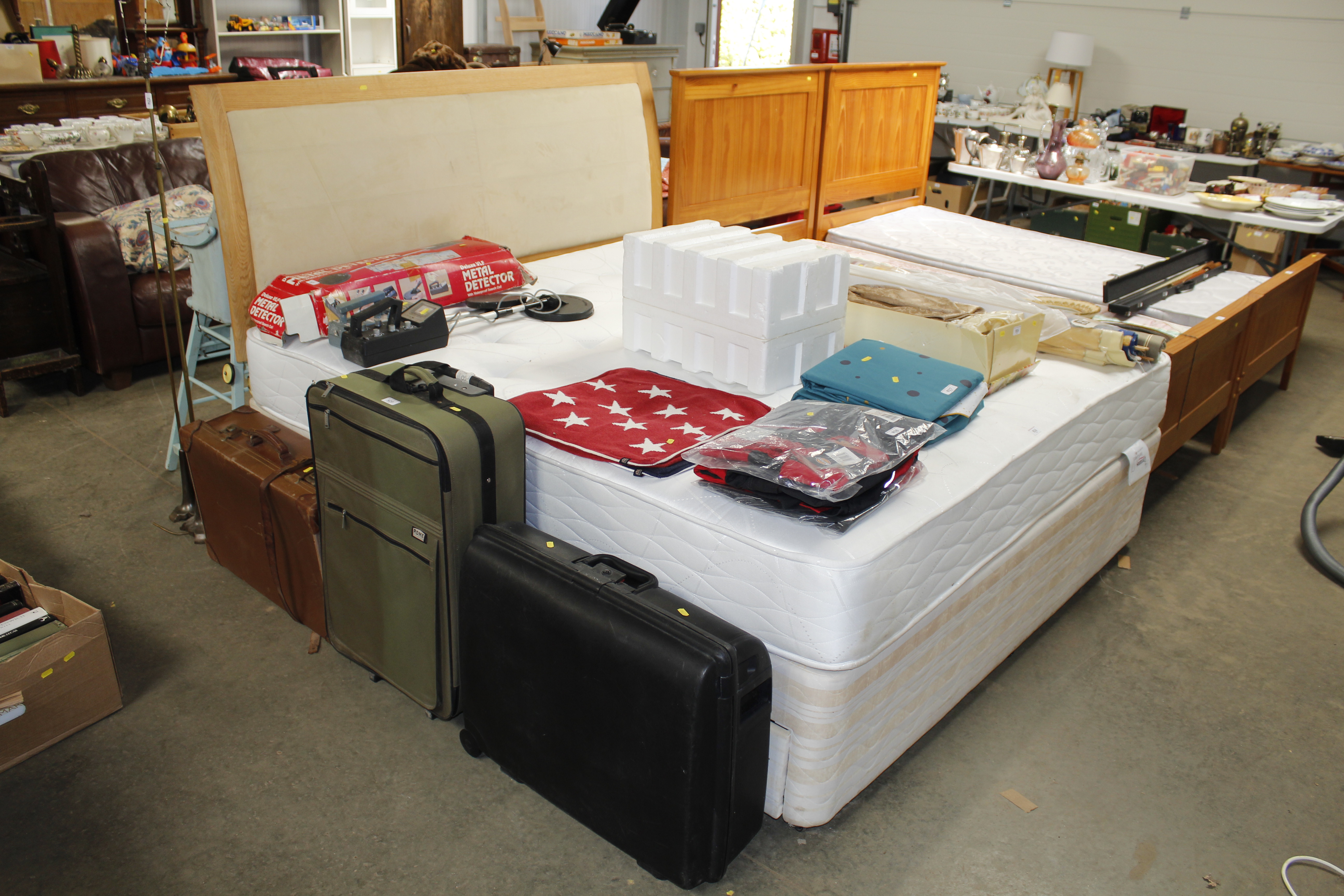 A double divan bed with head board and mattress