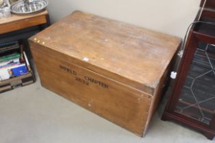 A wooden and brass bound trunk