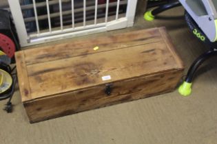 A pine storage box with three internal partitions