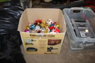 A box containing a quantity of festive and Christmas decorative baubles, decorations etc.