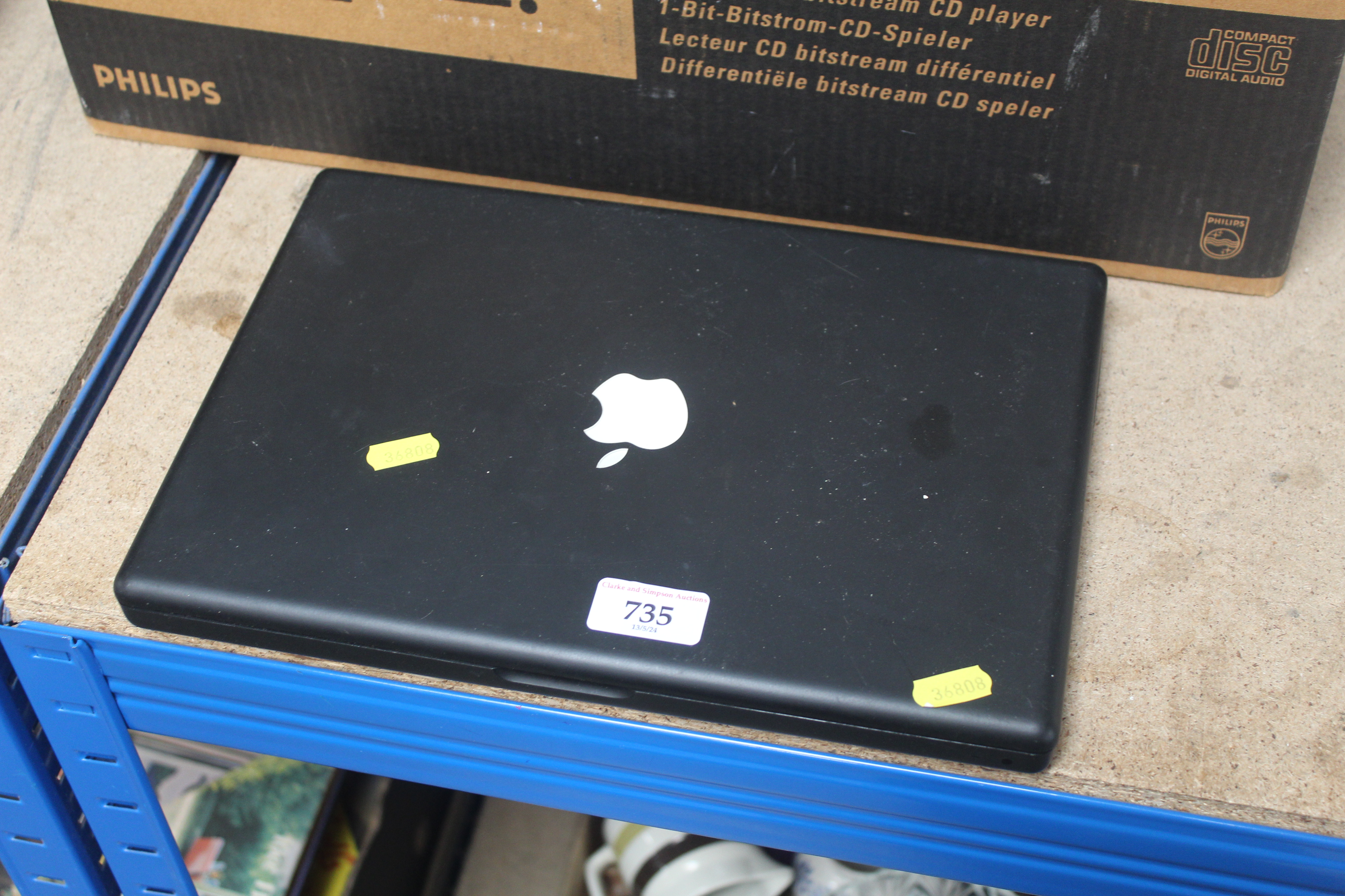 An Apple Mac Book lacking cables
