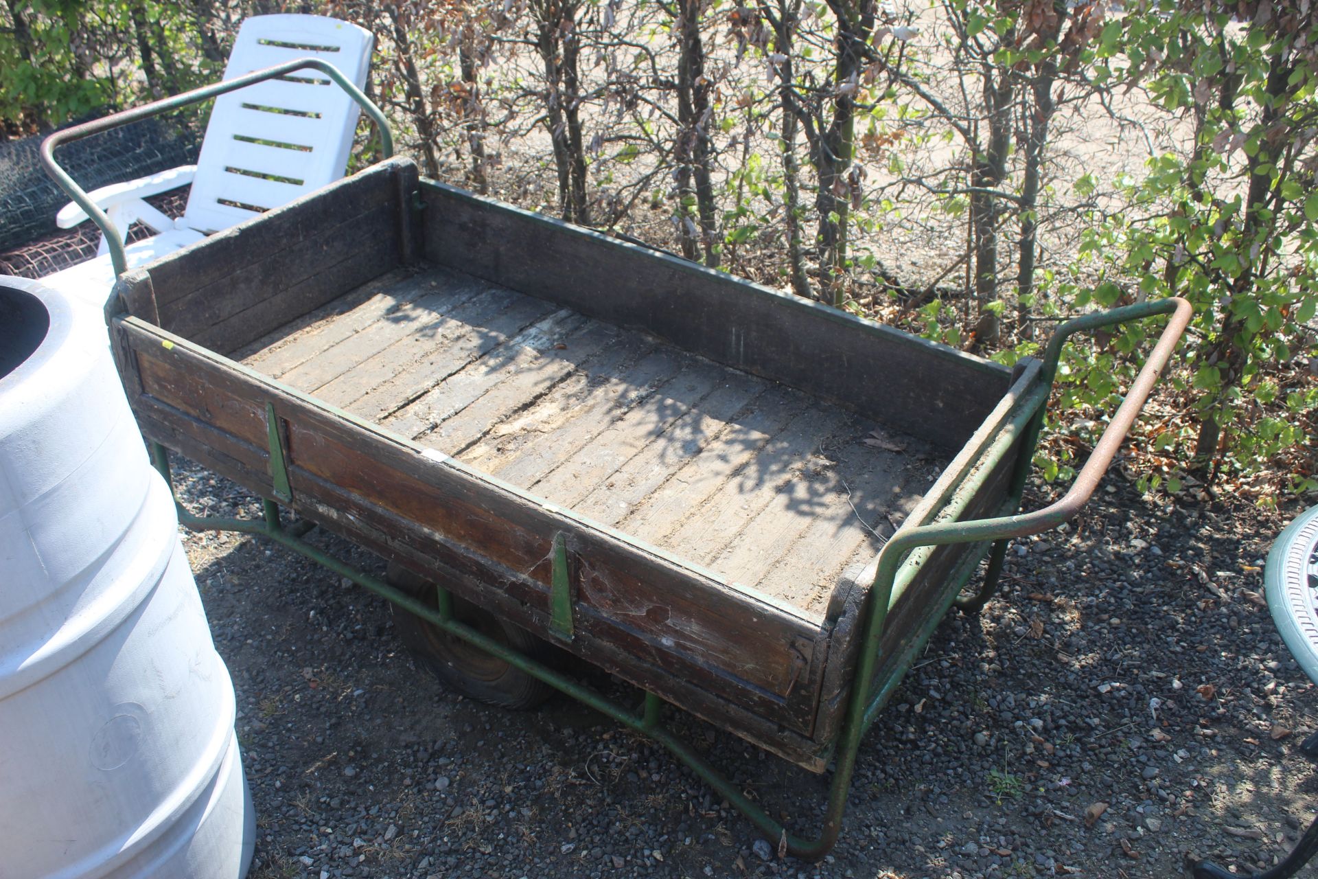 A two wheeled twin handled garden trolley