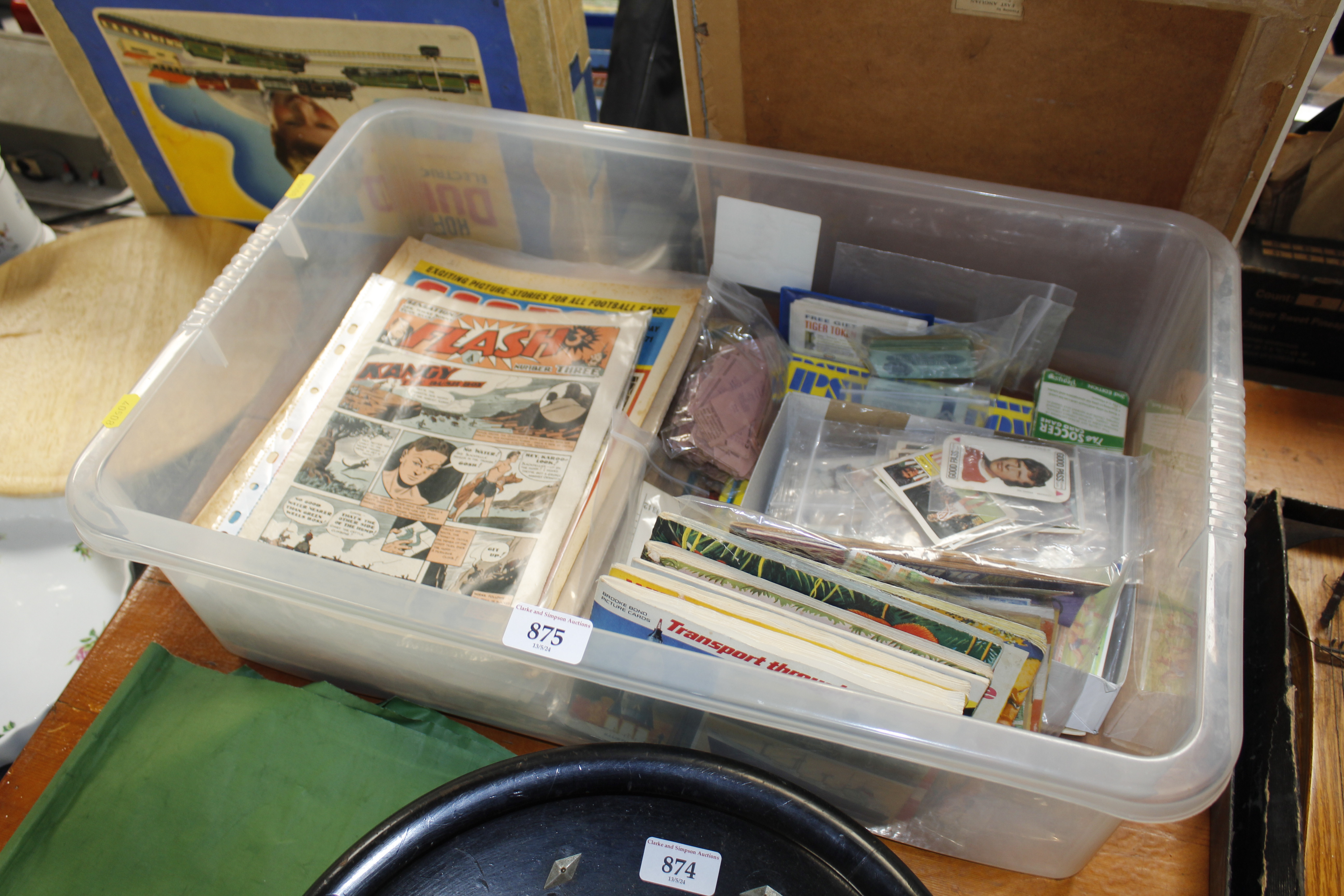 A box of ephemera to include comics, tea card albu