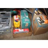 A box containing various screws, fasteners, rawl p