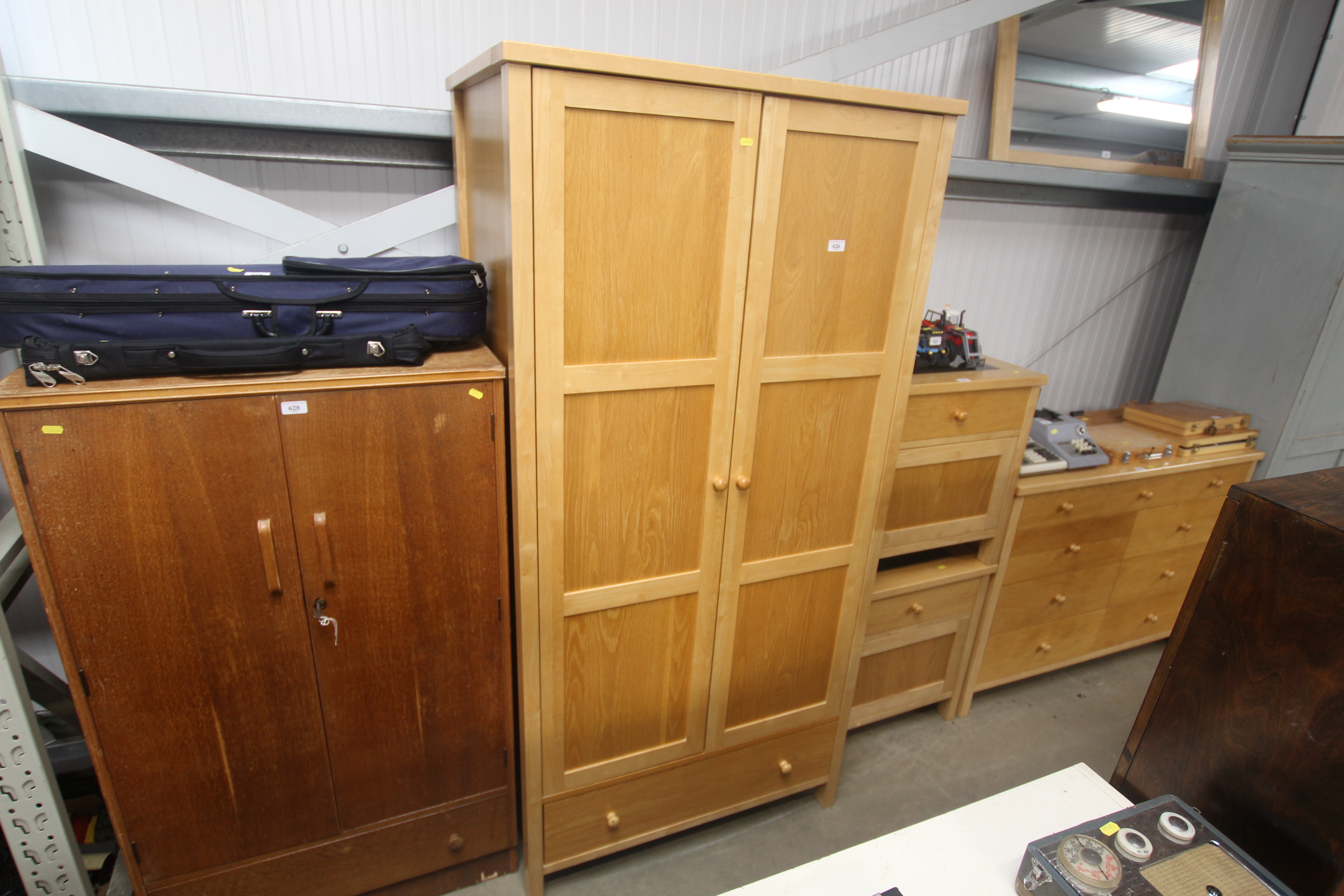 A modern lightwood wardrobe fitted single drawer b