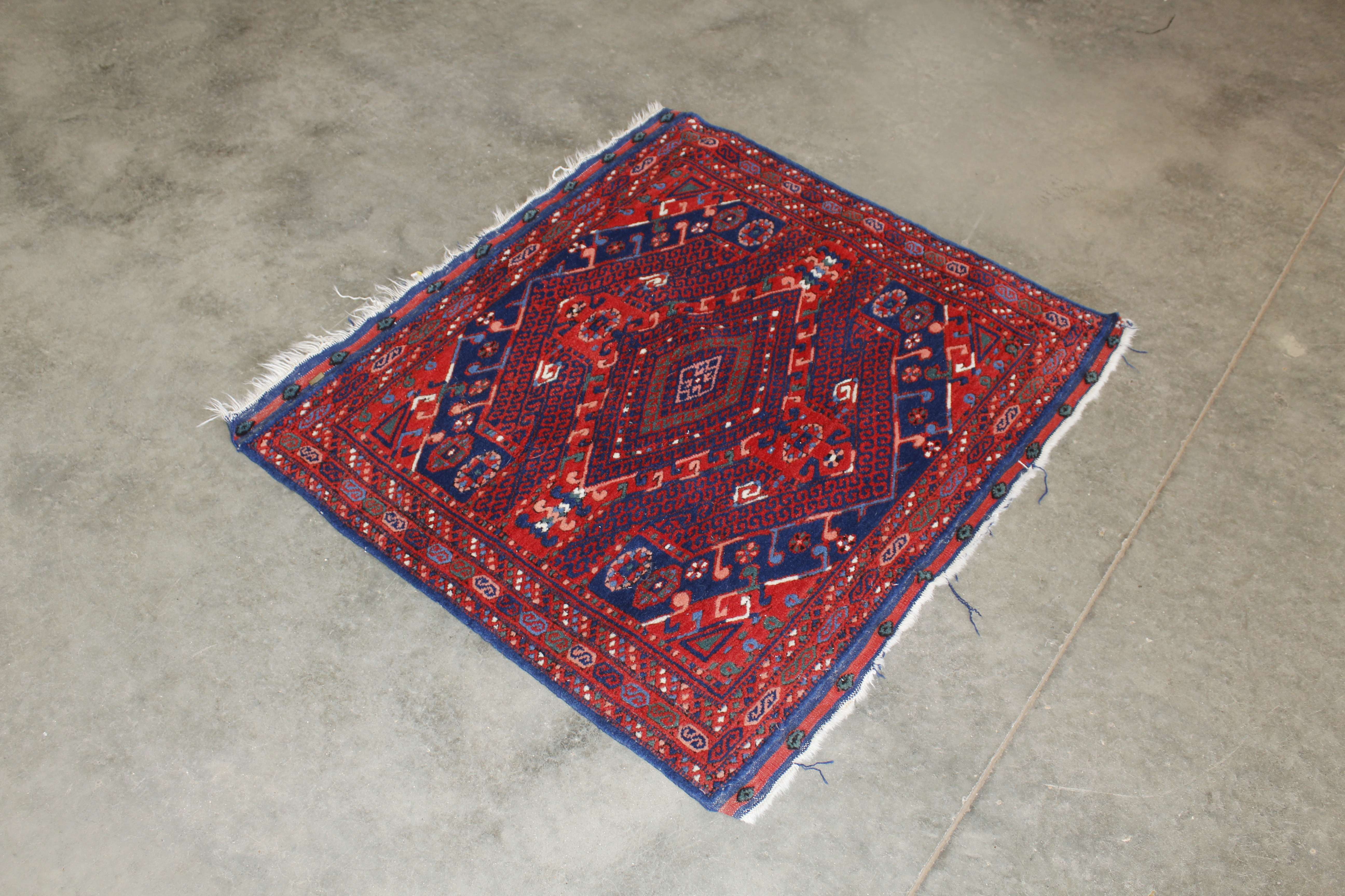 An approx. 3'6" x 3'3" Basmakci wall rug