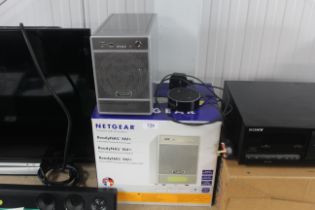 A Netgear desktop network storage box and an Amazo