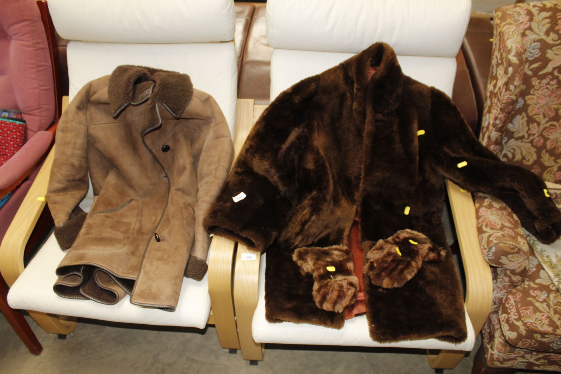 A suede coat and another coat with gloves