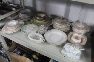 A collection of various patterned dinnerware