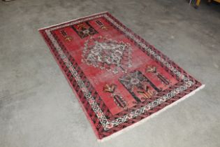 An approx. 6'10" x 4'2" patterned rug AF
