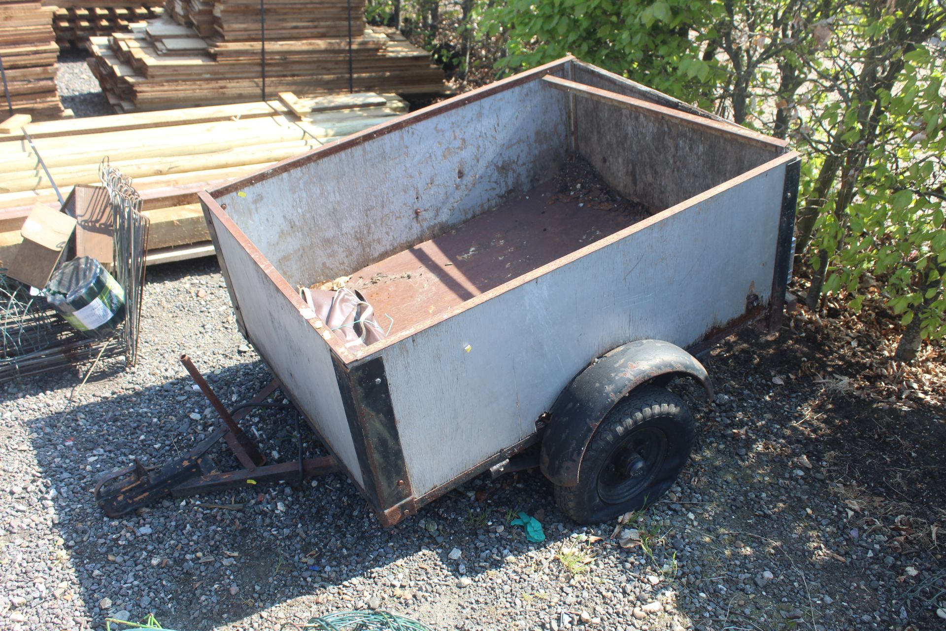 A single axle car trailer with wooden body sides m