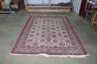 An approx. 10'4" x 6'6" red patterned rug AF