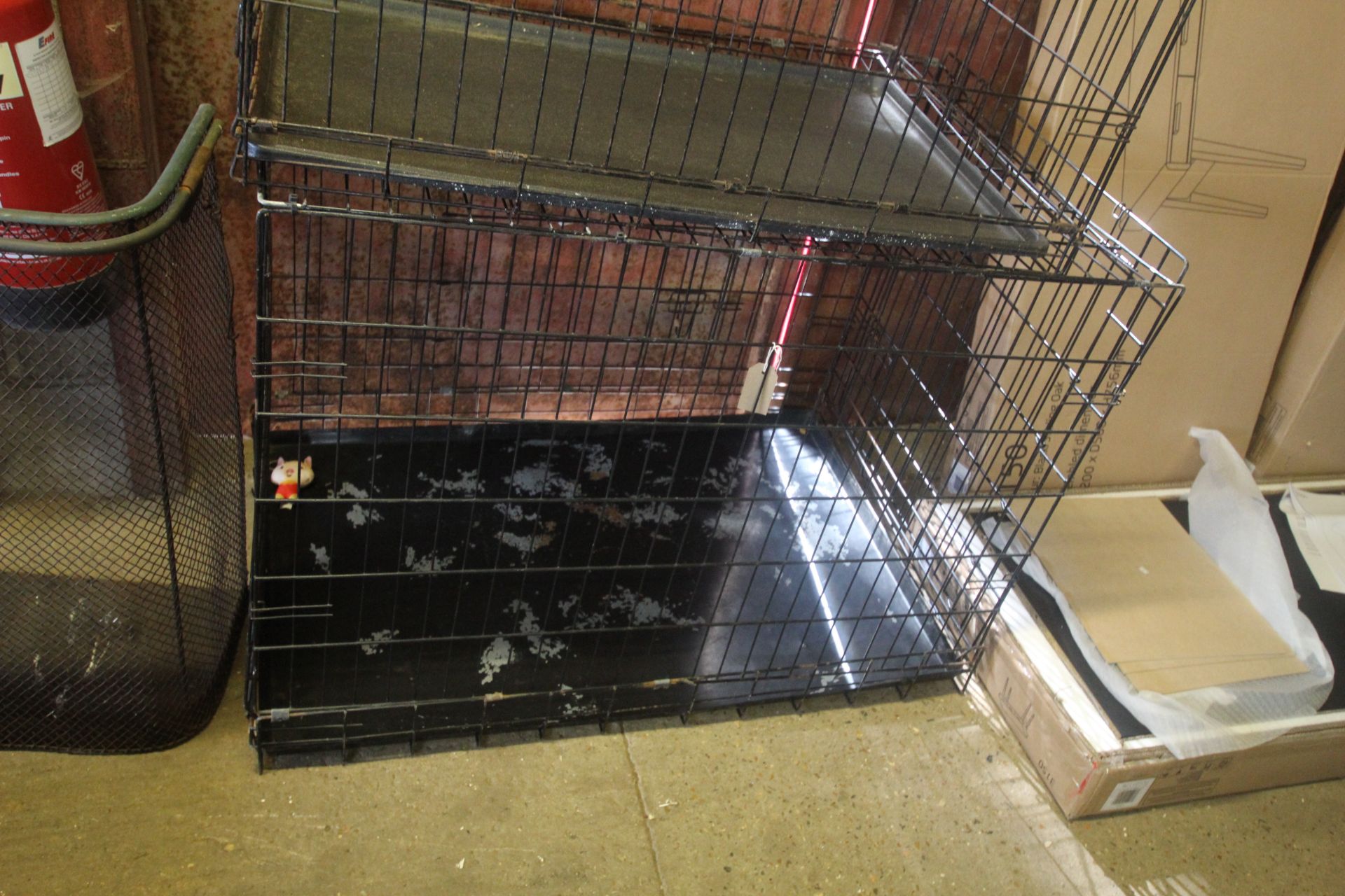 A large folding metal pet cage
