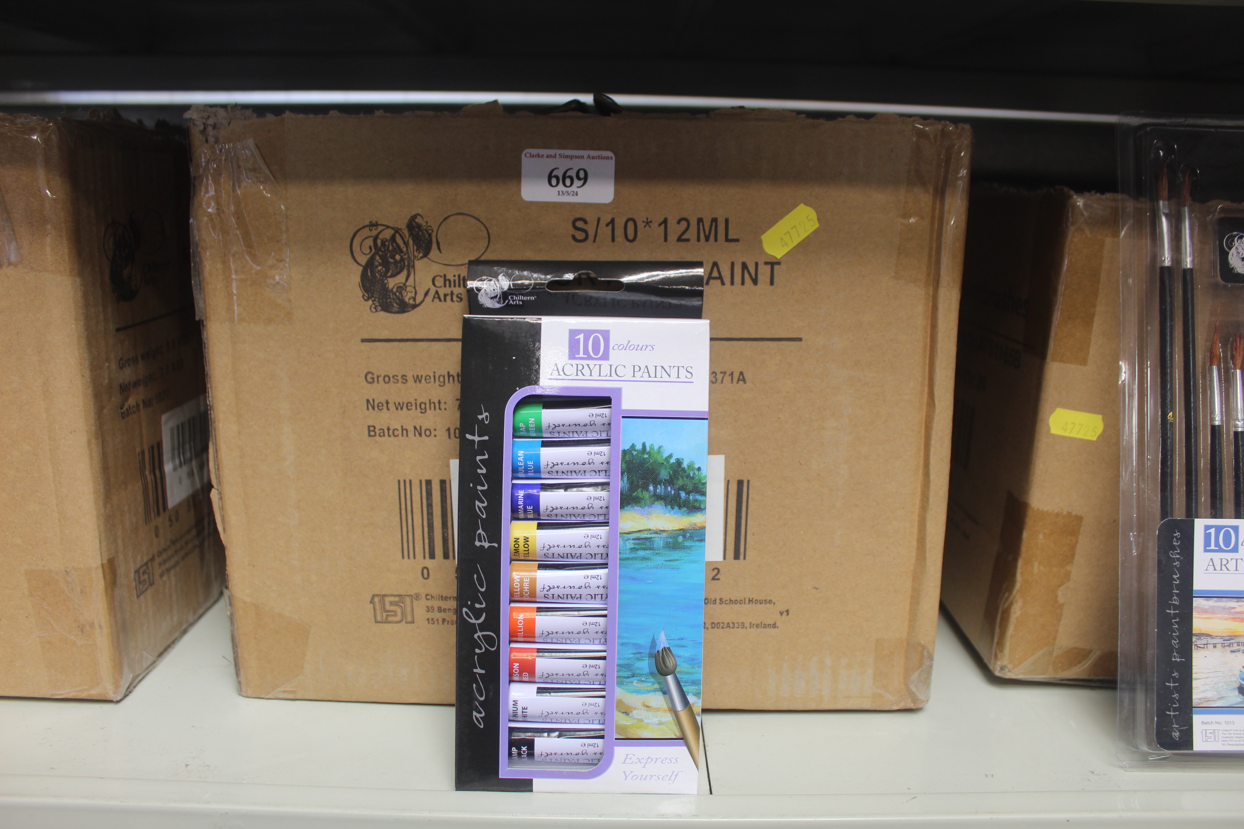 Two boxes containing a quantity of acrylic paints