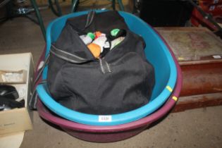 Two plastic pet beds and a holdall containing a qu